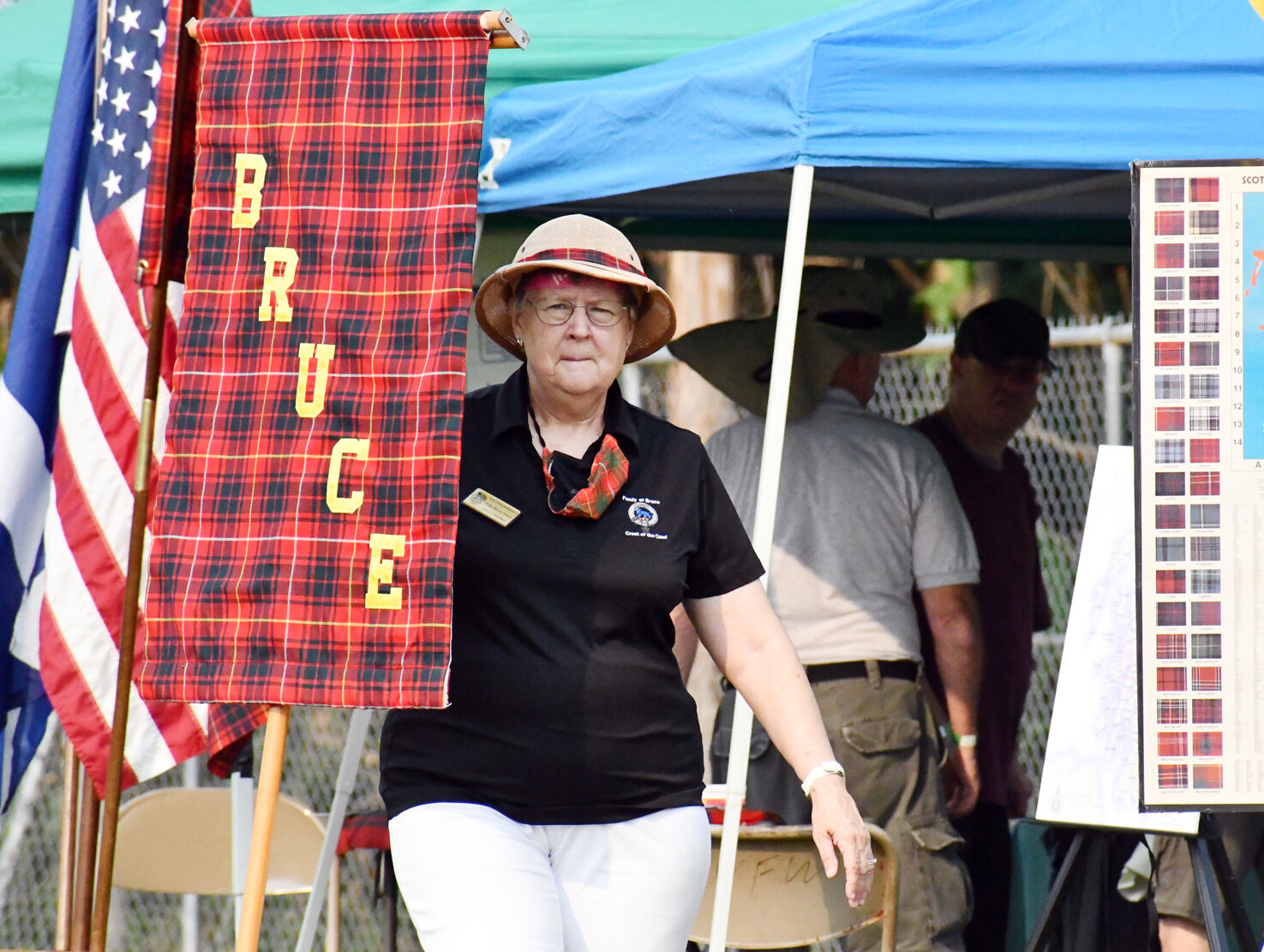 Pollie Bruce stands near her clan sign